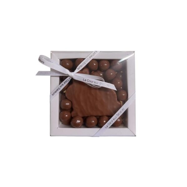 Lapinou gourmand au praliné croustillant aux noisettes façon gianduja et ses petits œufs. Composition au chocolat lait - 125 g environ.