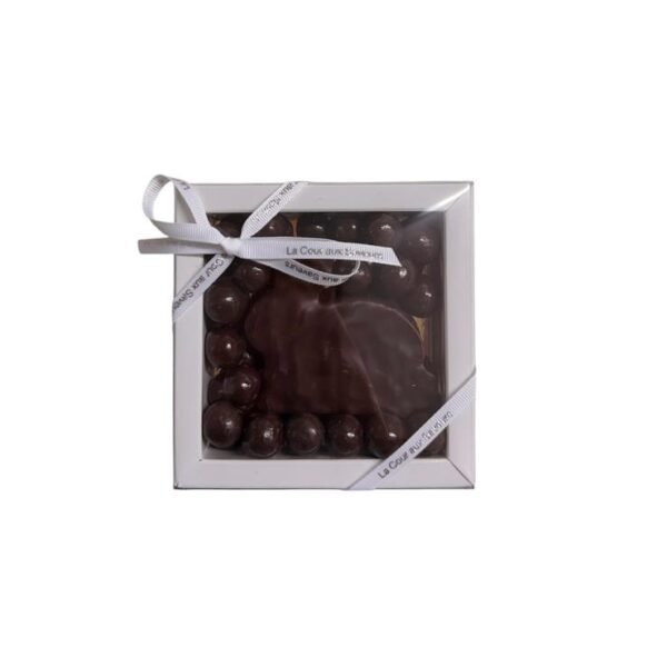 Lapinou gourmand au praliné croustillant aux noisettes façon gianduja et ses petits œufs. Composition au chocolat noir de 125 g environ.